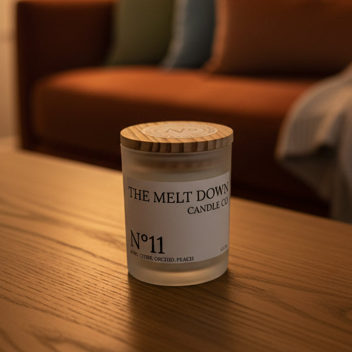 Candle with wooden lid on a wooden surface